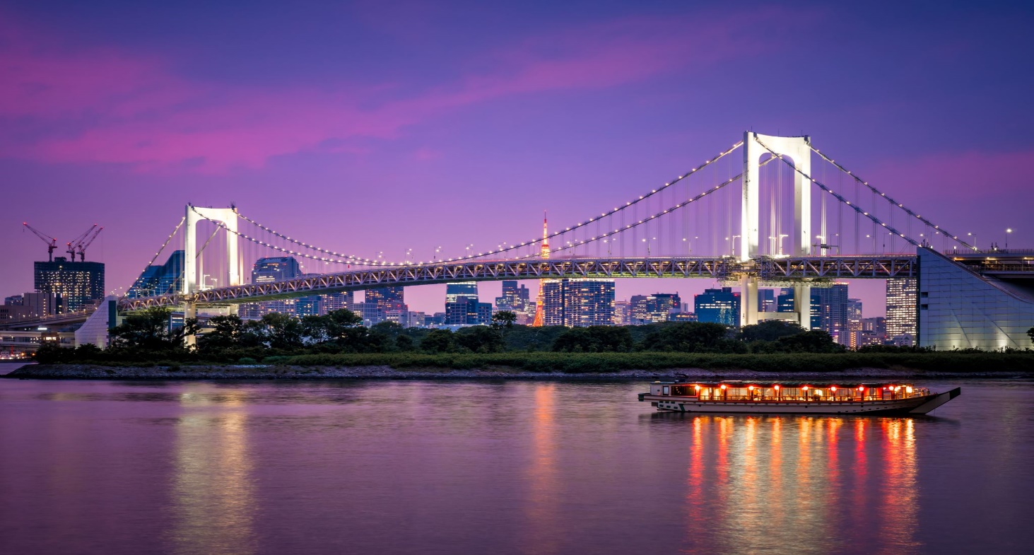 Dramatic sunset with rainbow bridge and Tokyo cityscape