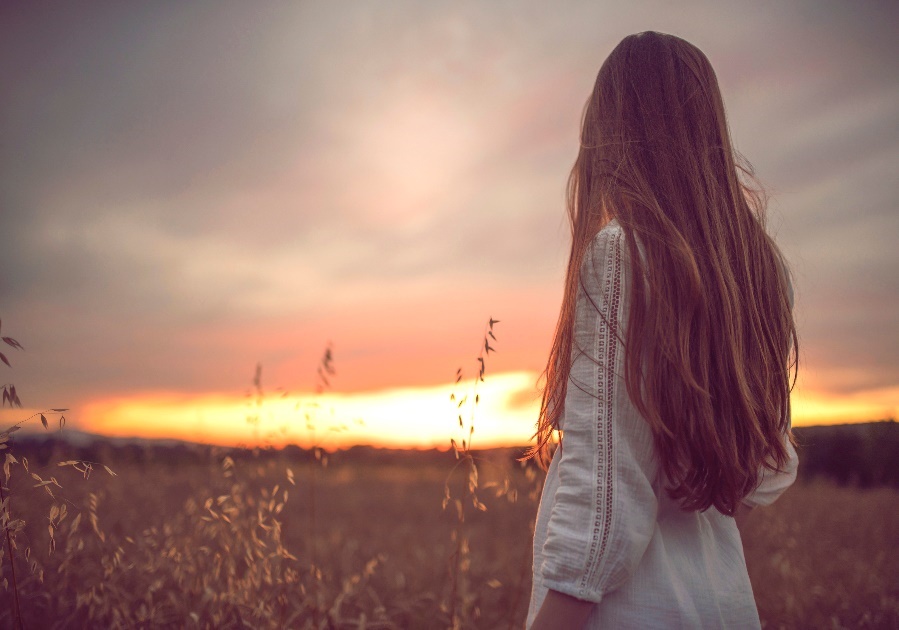 Woman outdoors at sunset